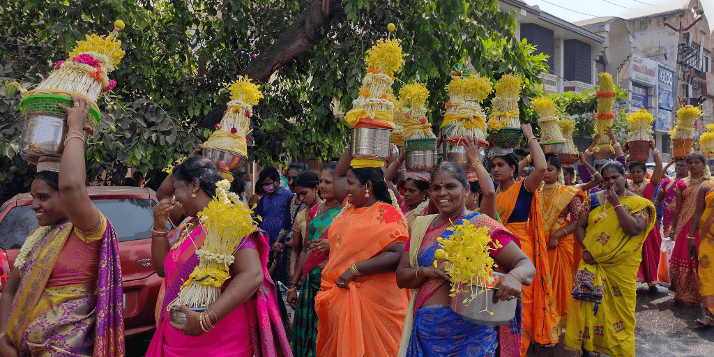 Women in village getting ready for a festival with flowers
