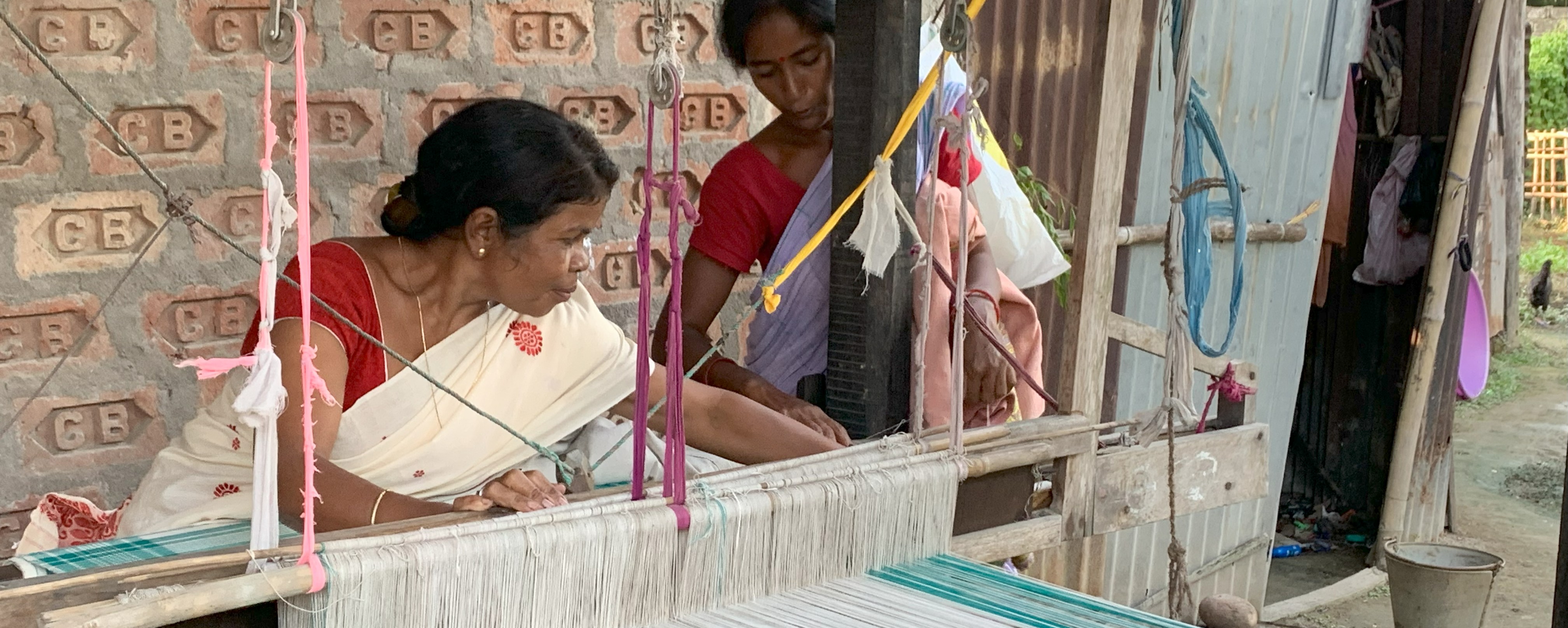 Woman working on handloom 