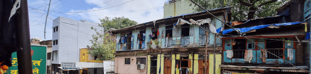 image of sex worker's home, women can be seen peering out of small windows